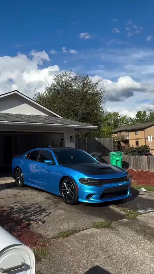 Blue Dodge Charger detailed in the driveway