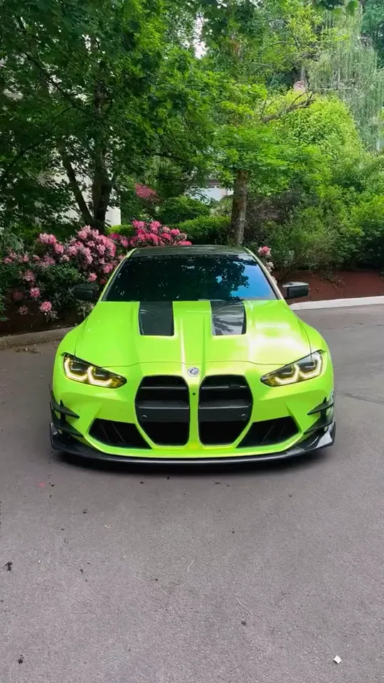 Lime green BMW M4 in the driveway